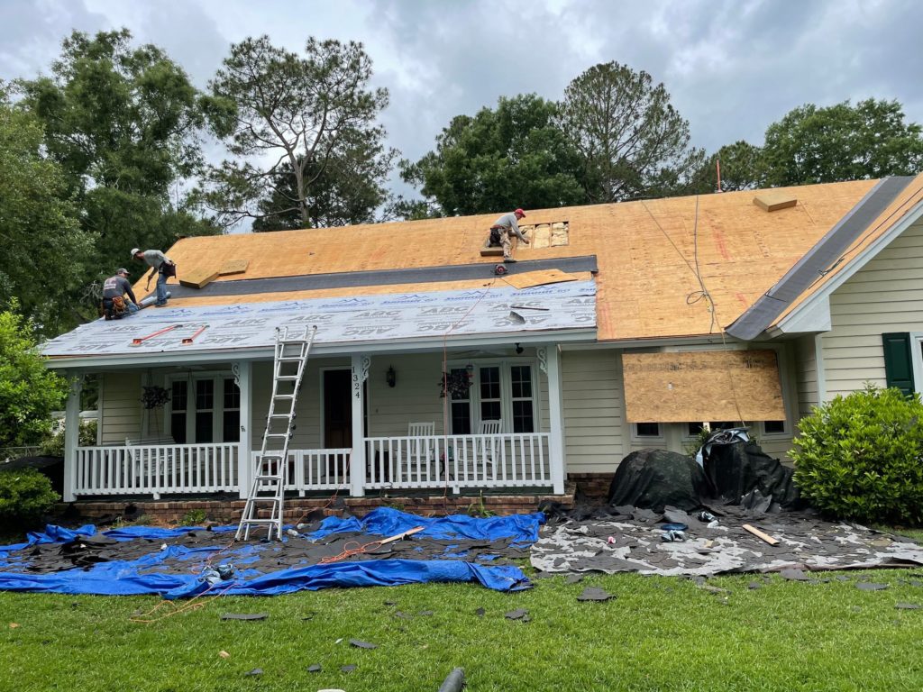 Crew installing roof